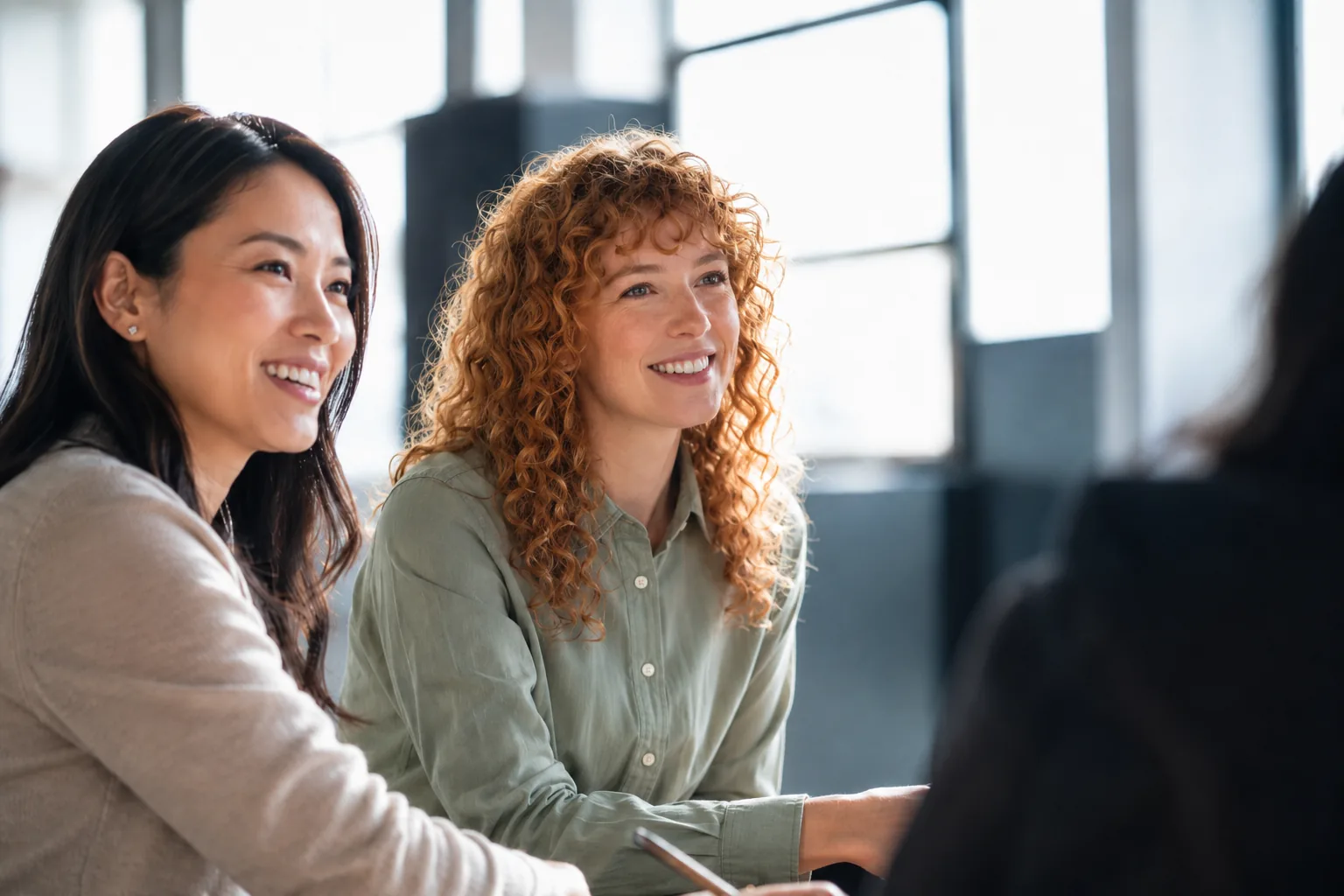 ThinkingAI team members in conversation during a working session